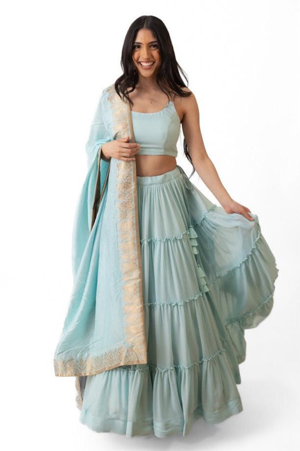 Elvia Sky Blue Shimmer Tiered Lehenga Choli Set with Gold Accents